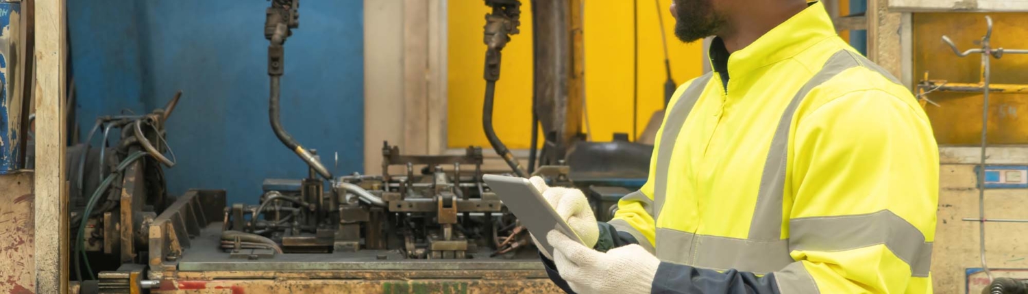 welding operator reviewing equipment