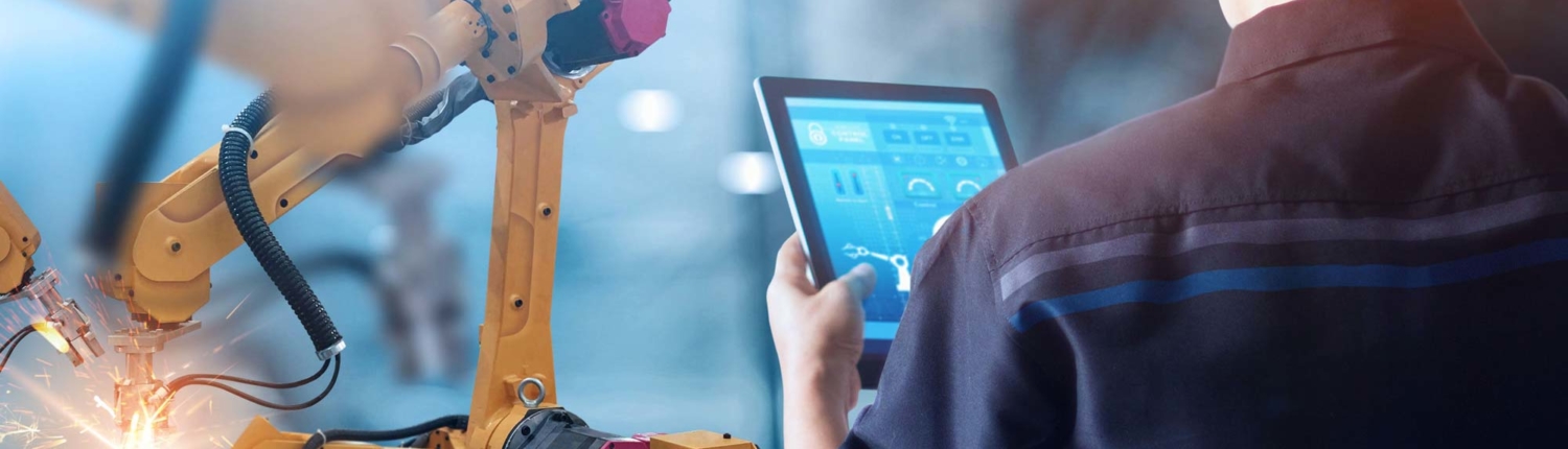 welding operator reviewing processes on a tablet