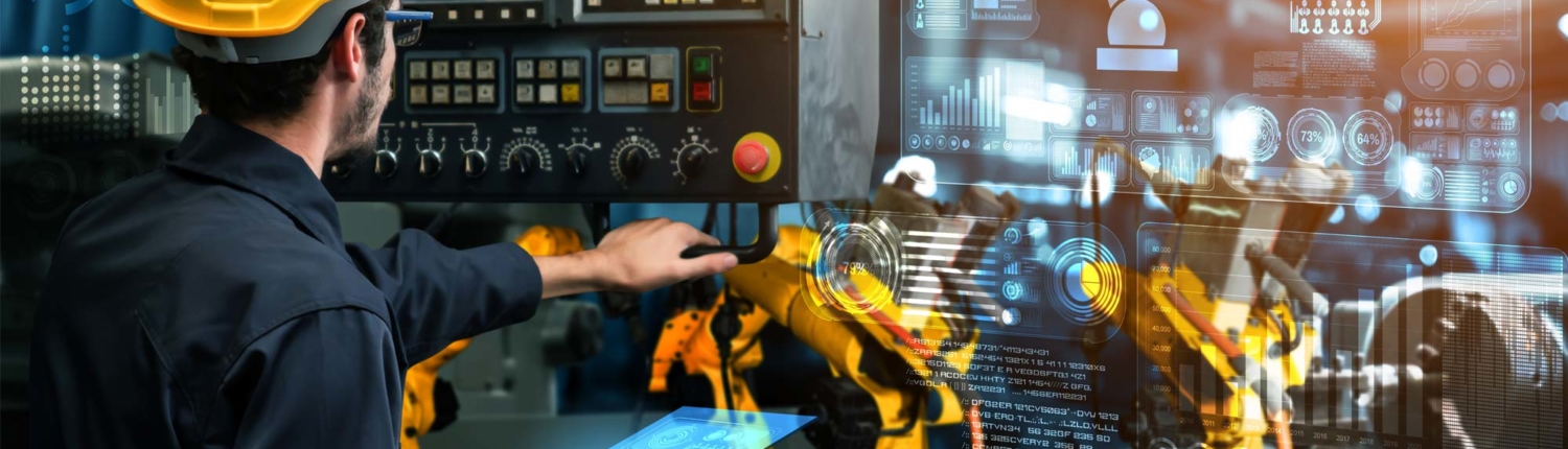 welding operator reviewing welding robotic arm performance on a screen