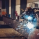Pereson welding metal beams