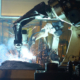 Automated welding machine in shop
