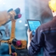 welding operator reviewing processes on a tablet